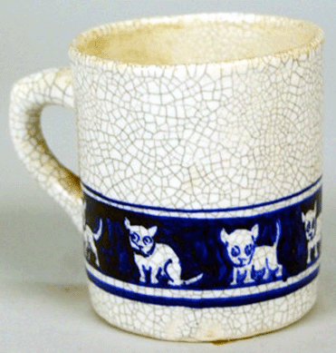 The rare 3½-inch Dedham Pottery mug in a dog pattern sold to a phone bidder for a record $19,550. 