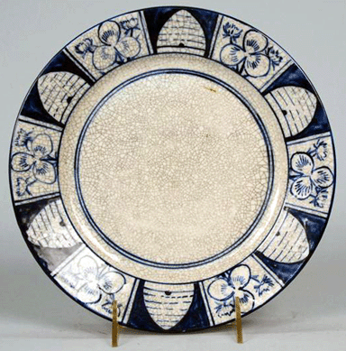 The Dedham Pottery plate attracted $16,100 for its rarity; it was decorated in the beehive and clover pattern.