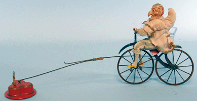 This very rare and unusual 17-inch-long Britains toy of painted metal features a whimsical hand-painted figure with a striking resemblance to the puppet show character "Punch.†The cloth-dressed fellow rides in a circle on a two-wheel bicycle attached by a wire support to a heavy base. A popular entry, it concluded its auction outing at $21,850.