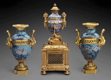 Garniture of late Louis XV mounted goût grec clock and two vases;  porcelain: Chinese, Qing dynasty, Qianlong period (1736‱795); mounts: Paris, about 1770, hard paste porcelain, gilt bronze, enameled metal. Anonymous loan (only the clock is on loan). Courtesy Museum of Fine Arts, Boston.