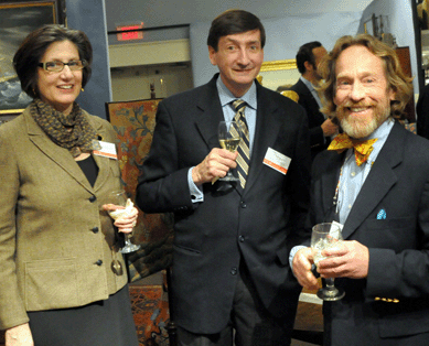 Dean Lahikainen, center, curator of American decorative art at the Peabody Essex Museum, with his wife, Betsy, chat with Americana dealer Don Heller during preview.