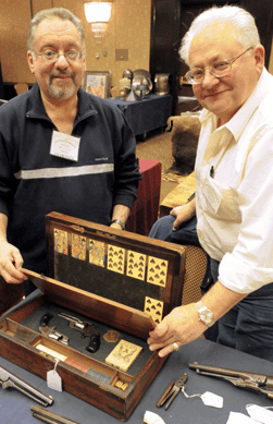 An early lap desk that had been retrofitted in the Nineteenth Century and outfitted as a gambler's box was offered by New York dealers Jay Grunfeld and Richard Kravarik. Chips, cards, dice, a lawman's badge and pistols were housed in the fitted box.