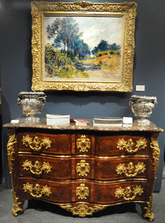 "Pine Trees at Varengeville†by Claude Monet was displayed above a marble top commode by Francois Garnier, circa 1720, at M.S. Rau, New Orleans, La.