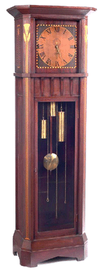 A unique Arts and Crafts tall case clock, this Shop of the Crafters "Manchester†model featuring Egyptian revival inlaid designs reached $15,600.