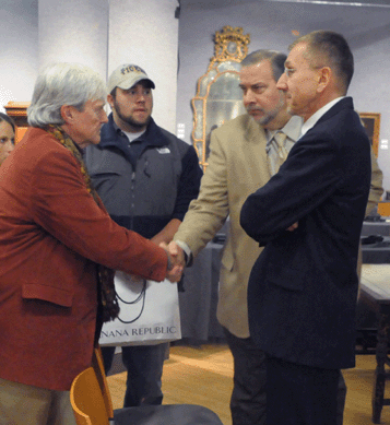 Max Foote, left, being congratulated after the auction by Gary Espinosa and Brooke Sivo.