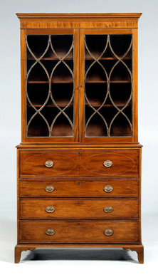 The top drawer of the lower case on this 1795‱805 mahogany Charleston inlaid secretary bookcase opens to a butler's desk. From a venerable Georgetown, S.C., family, it sold for $28,750.