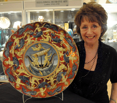 Pottery designed by William De Morgan was featured at Sylvia Powell Decorative Arts, London. The dealer called her De Morgan collection the "largest outside of a museum†and stated that the designer was at "the top of the tree of the English Arts and Crafts Movement.†Included among the assortment was an impressive "Galleon Charger†from 1901 with a central decorated panel depicting three putti in a galleon. 