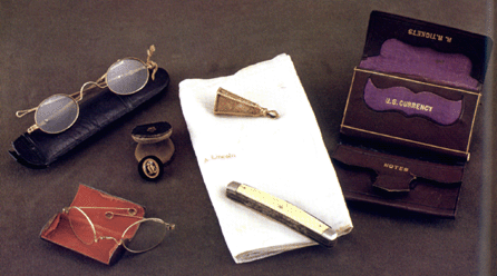 The contents of Lincoln's pockets the night he was assassinated, including two pairs of spectacles, a pocketknife, billfold and handkerchief, are exhibited in "With Malice Toward None†at the Library of Congress, part of its trove of Lincolnania. Library of Congress.