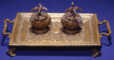 This inkstand stood on the desk of an officer in the War Department's telegraph office, across the street from the White House, where Lincoln often stopped by to learn the latest news from the war. The president, escaping interruptions at the White House, reportedly composed an early draft of the Emancipation Proclamation while sitting there in the summer of 1862. National Museum of American History.