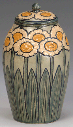 Newcomb Pottery, lidded jar with a design of stylized daisies, 1903. Designed and executed by Harriet "Hattie†Coulter Joor; potted by Joseph Fortune Meyer. Glazed earthenware, height 7¾ inches.
