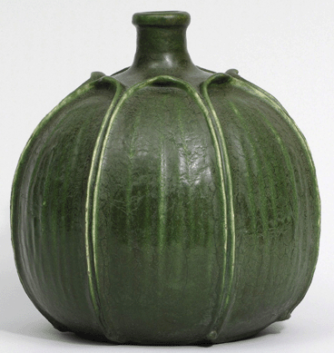 The rare mark on the underside, simply the name "GRUEBY†arranged in a horizontal line, suggests a very early date for this example, probably before December 1899 when the more standard circular trademark was registered. This pot, one of the first of Grueby's matte glazed vessels to be publicized, was illustrated in the December 1898 issue of House Beautiful. Designed by George Prentiss Kendrick and executed circa 1898, 9¼ inches high.