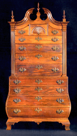 The top lot in the sale, the Captain Edward Allen Chippendale carved and figured mahogany bombe chest-on-chest, probably Salem, Mass., circa 1780, 91 inches tall, went for $1,762,500 against an estimate of $800,000․1.2 million. It was bought by C.L. Prickett of Yardley, Penn. Edward Allen is inscribed in chalk on the backboard of the upper case.