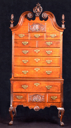 The top lot in the sale, the Francis P. Garvan rococo carved and figured walnut scroll-top high chest of drawers, the carvings attributed to Nicholas Bernard, Philadelphia, circa 1755‱760, sold for $482,500, about in the middle of the $200,000․1 million estimate. The piece measures 8 feet tall, 43 inches wide, and appears to retain its finials and the majority of the original hardware. The provenance lists the collection of Francis P. Garvan, 1931, and John S. Walton, 1968.