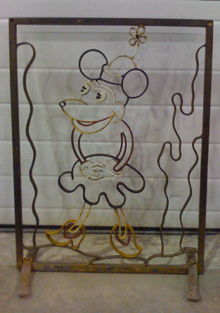 Painted or baked-on enamel cast iron Minnie Mouse Art Deco fireplace screen, French, $950, Andrew Martin, Washington, D.C. 