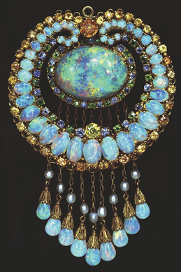 Tiffany & Co. (American, 1837⁰resent), Louis Comfort Tiffany (American, 1848‱933), designer, Indian-style pendant, opal pendant set with Australian opals, topaz, crysoberyl, green andradite garnets, sapphires and pearls, 1915‱920. American Museum of Natural History, gift of Lilias Betts.