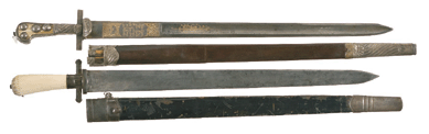 Two German hunting swords with sheaths realized $5,463.