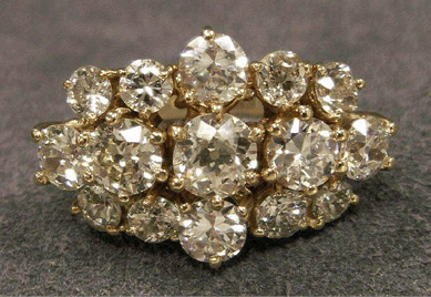 A good buy at $3,105 was this 14K yellow gold and diamond cocktail ring with total weight 5.92 carats.