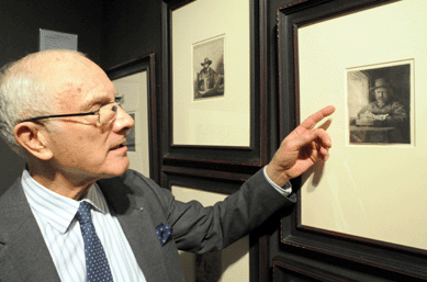 Stanley Johnson with one of two known examples in America of either first, second or third state impressions of Rembrandt's "Self Portrait Drawing at a Window†etching, circa 1648. It was marked sold during the preview at R. Stanley Johnson, Chicago.