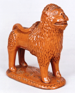 The top lot among redware was a glazed figure of a lion believed to be of Pennsylvania origin and dating to the third quarter of the Nineteenth Century. With exceptional condition and a highly detailed expressive face, the lion roared all the way to $15,525.
