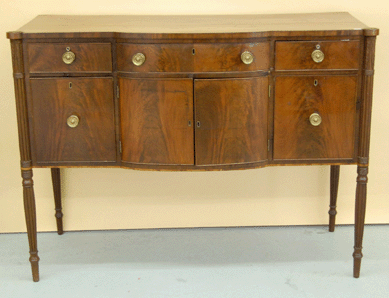 The Massachusetts Sheraton carved mahogany sideboard was nicely proportioned and went to a phone bidder for $15,210.