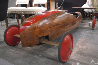 The booth of Deco Etc was enough to get buyers revved up with this sporty wooden car.