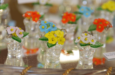 Karen Redinger, came to the show for the first time from Litchfield, Conn., with hankies, textiles, accessories and these Czechoslovakian glass place card holders.