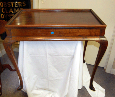 A Newport mahogany tea table, circa 1760, attributed to John Goddard had a molded top and slipper feet and realized $63,250 from a phone bidder. 