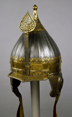 Helmet, Turkey, late Sixteenth⁥arly Seventeenth Century, watered steel, silver and silk fabric; forging, chasing, carving and damascening; 8 11/16 inches diameter. Courtesy The Moscow Kremlin Museums.