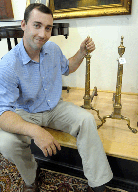 James Pook with a pair of Philadelphia Federal andirons attributed to Daniel King, circa 1790, that sold at 25,740.