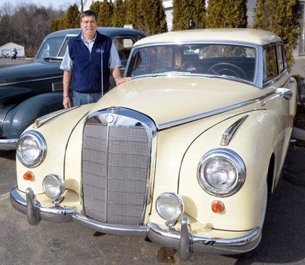 Auctioneer Tim Chapulis with the 1954 Mercedes 300 "Little B†Adenauer, the most expensive vehicle on the market during its day; it sold at $25,875.