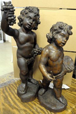 A nice pair of carved putti, measuring more than 2 feet tall, brought $1,495.