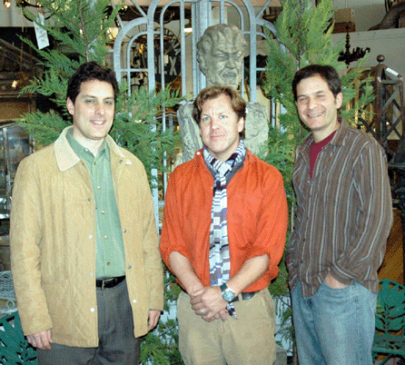 Co-owners of Kamelot Auction House Joe Holahan, left, and Jeff Kamal, flank Jeffrey Henkel, antiques dealer, who assists in the cataloging and the auction. ⁒. Scudder Smith photo