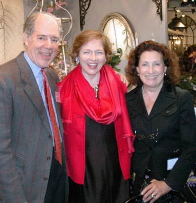 John Peden and Paulette Peden of Dawn Hill Antiques flank the show's director, Catherine Sweeney Singer.
