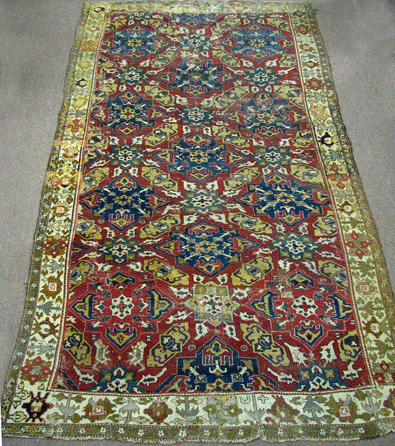 With significant wear and a replaced Persian border, the circa 1800 Caucasian rug that measured 7 feet by 13 feet 7 inches brought $49,450.