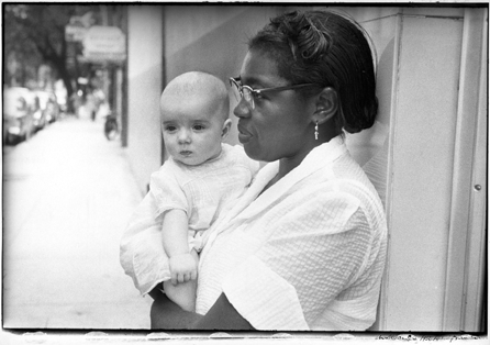 In a time-honored pose, an African American nurse holds a white infant in "Charleston, South Carolina,†1955. Frank was struck by the prevalence of racial discrimination in America and interactions between whites and blacks, as here. Susan and Peter MacGill. ⁐hotograph ©Robert Frank, from The Americans