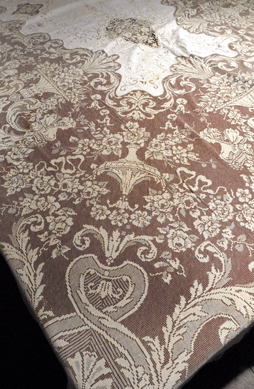 Despite some stains, the cream linen and lace banquet cloth, circa 1900, sold for $2,300.