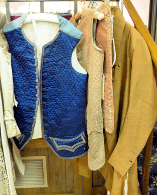 A gent's silk frock coat, circa 1825, sold at $4,887. The wool tailcoat, right, realized $1,380.