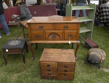 A fine lowboy, rear center, stood out among furniture and fine decorative objects at Melissa's Antiques, Dedham, Mass. ⁍ay's