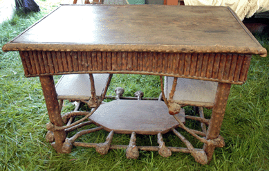 Rustic table with chip carved decoration by Rev Ben Davis at Magoun Brothers, Paris, Maine ⁃entral Park