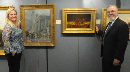 Sandra Germaine and Gene Shannon with two stars of the show, the William Louis Sonntag Jr "St Paul's Chapel, New York,†left, that sold for $36,000 and the Martin Johnson Heade that fetched $132,000. 