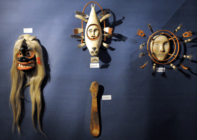 A rare early Twentieth Century "seal-human†Yupik Eskimo element mask from the Hooper Bay area, second from left, was among the featured items at Myers and Duncan, New York City and Denver.