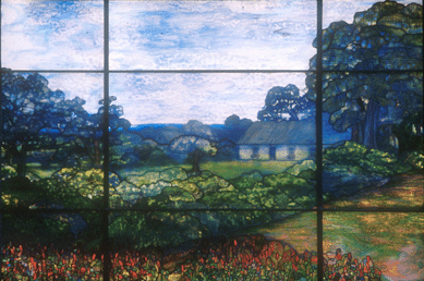 Commissioned for the Greensburg residence of Thomas Lynch, the Tiffany Studios window depicts the home of Lynch's father. It is unusual in that it replicates an actual scene in Ireland.