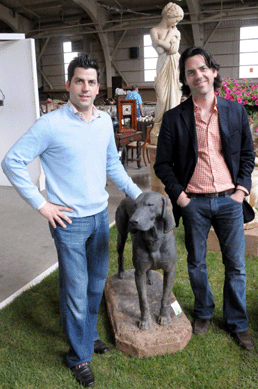 Michael and Mark Millea with one of the cast iron dogs from the gardens at Duke Farms. The dog sold at $8,700.