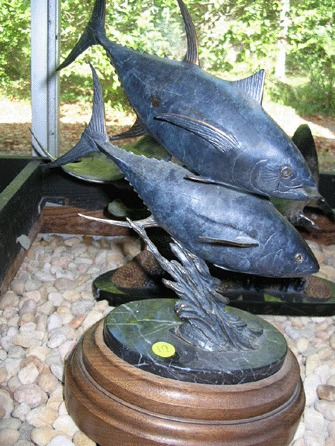 A bronze of a pair of yellow fin tuna by listed artist Kent Ullberg is among the items reported stolen.