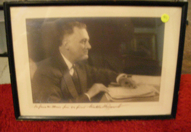 Two Franklin Roosevelt photos with inscription and signature were taken.