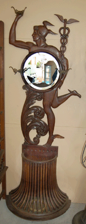 The Mercury carved umbrella stand and coat rack from the early 1900s was the sale's marquee lot. Wearing his winged shoes and carrying the caduceus, a staff with two entwined snakes, the unique full-standing carving brought a high bid of $6,600 from a doctor bidding on the telephone.