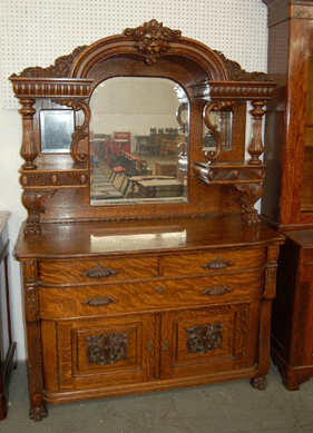 An R.J. Horner & Co. large oak sideboard of quartersawn oak had been refinished, but professionally so. It brought $2,100, going to a doctor bidding in the gallery.