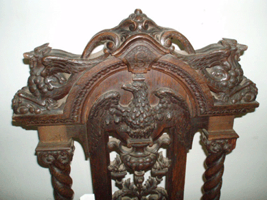Detail of a Centennial hand carved chair with an eagle crest and an attached label reading: "Chair was designed and made by pupils of The School of Industrial Art, Broad & Pine Sts., Phila. For Theodore Corsou Search.†The chair sold for a modest $690.