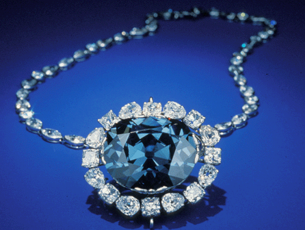 First sold in the Seventeenth Century, the violet-colored Hope diamond was roughly cut and weighed more than 112 carats. In 1910, Evalyn Walsh McLean of Washington D.C., viewed it while in Paris at Cartier. Deciding that she did not like the setting, Pierre Cartier had the diamond reset and took it to the United States where he left it with McLean for a weekend. The sale was completed in 1911 with the diamond mounted as a headpiece amid three tiers of large white diamonds. It later became the pendant on a diamond necklace. Harry Winston Inc of New York City purchased McLean's entire jewelry collection, including the Hope diamond, from her estate in 1949. For the next ten years, the Hope diamond was shown at many exhibits and charitable events by Harry Winston, until 1958, when it was donated to the Smithsonian Institution. It has left the Smithsonian only a handful of times since it was donated. Courtesy of the Smithsonian Institution.