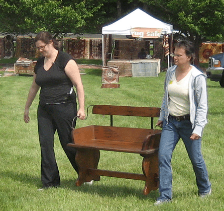 A perfectly refinished wagon seat was an early sale for Mark and Teresa Ridgeway, Terry's Treasures, Mahopac, N.Y.